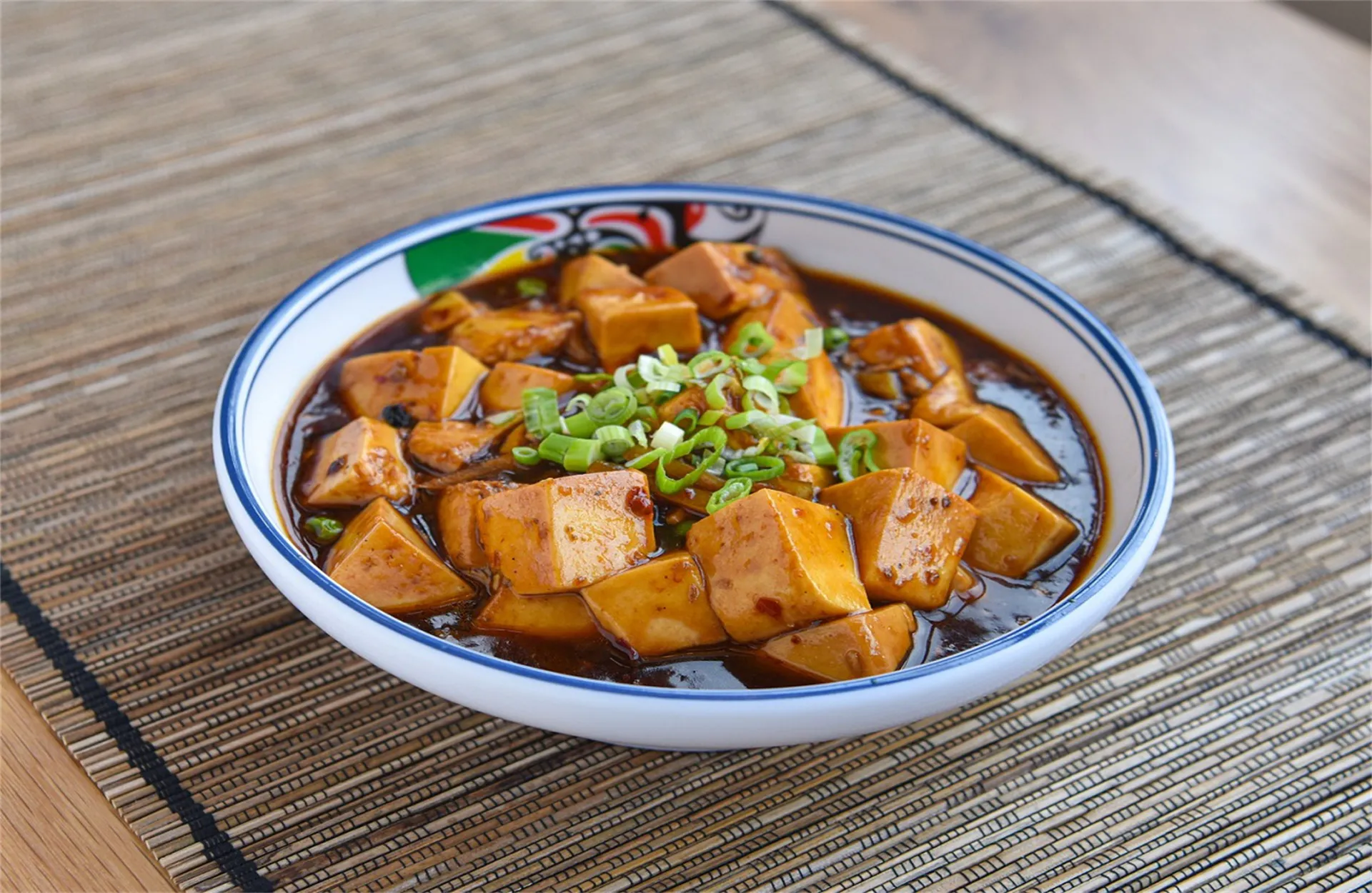 Spicy mapo tofu topped with green onions at Happy Oriental Cafe, a Chinese Restaurant in Longview